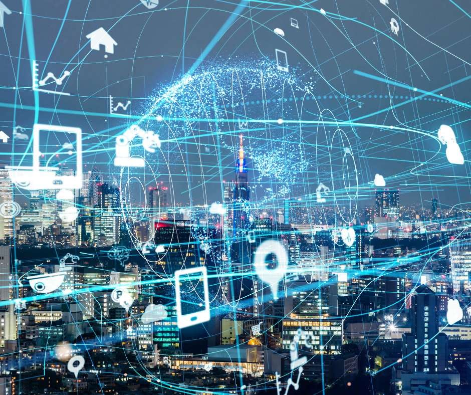 Network and data symbols overlaying a cityscape at night, signifying Fluid IT's expert management services in today's fast-paced business world.