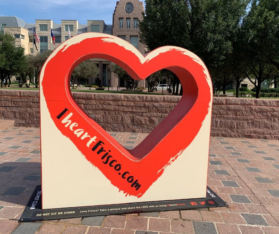 I Heart Frisco' sign in front of the Frisco Town Hall, symbolizing Fluid IT's dedication to protecting the digital heart of local Frisco businesses with robust cybersecurity solutions.