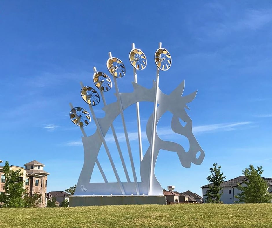 A modern sculpture of a horse in Frisco, representing the strength and grace of Fluid IT's cybersecurity solutions designed to protect and defend local businesses against digital threats.