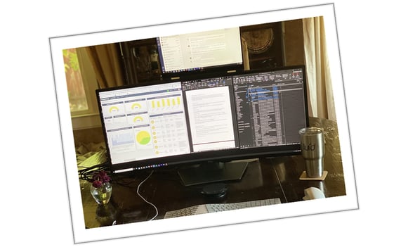 A worskstation showing the remote work culture and the screen showing different softwares and apps used.